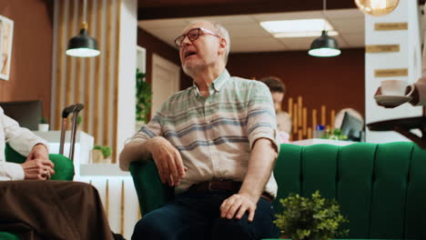 retired people chatting in lounge area