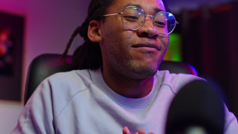 happy man with glasses smiling and looking at the camera