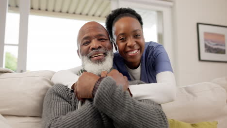 Smile,-face-and-nurse-hugging-a-patient-on-a-sofa