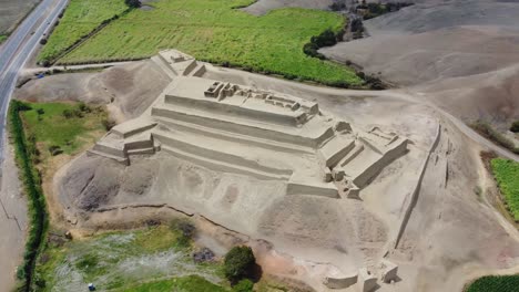 drone video of an ancient inca fortress next to the highway