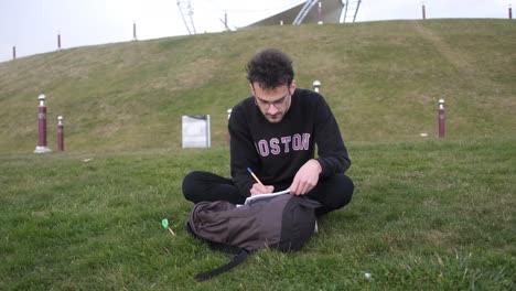 young man working in grass