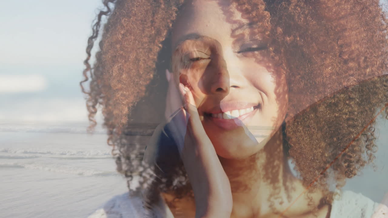 Overlaying serene beach landscape, woman with curly hair creating animation art