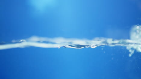 engaging slow-motion close-up of waves on water, emphasizing the refreshing qualities of clean drinking water and its clarity.
