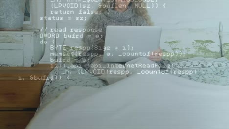 Animation-of-data-processing-over-woman-using-laptop