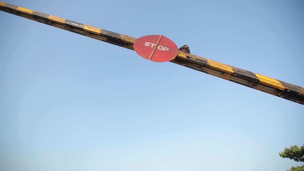 indian railway level crossing train road coming down stop sing close up