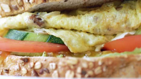 egg sandwich and chips on plate close up