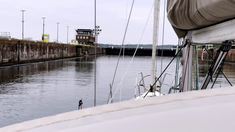Navigating the Kiel Canal Sailboat Enters the Massive Locks, a Feat of Engineering Connecting the North and Baltic Seas on a Cloudy Day
