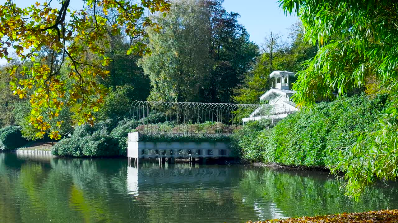 Scenic Lake with Foliage and Architecture