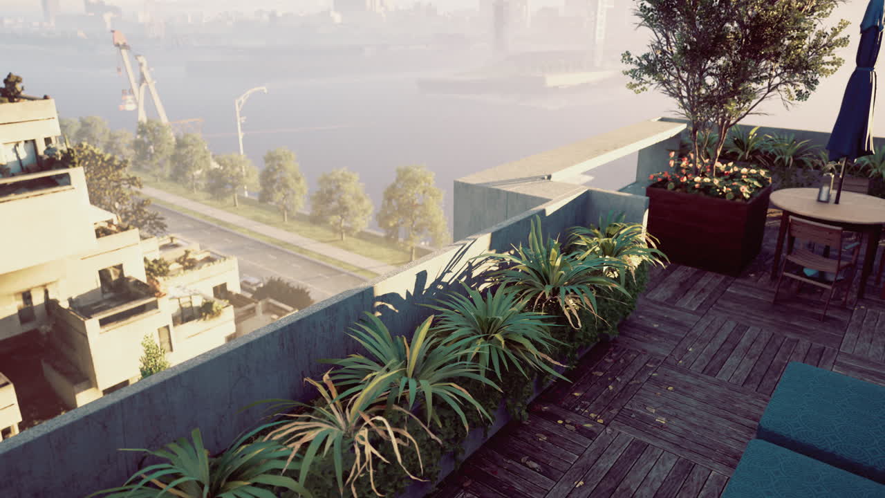 Rooftop terrace with lush plants overlooking a serene waterway during sunset
