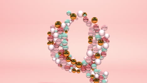 letra hecha de cuentas, bolas de vidrio, perlas pastel, joyas de cristal y oro