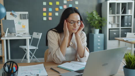 woman experiencing stress in modern office