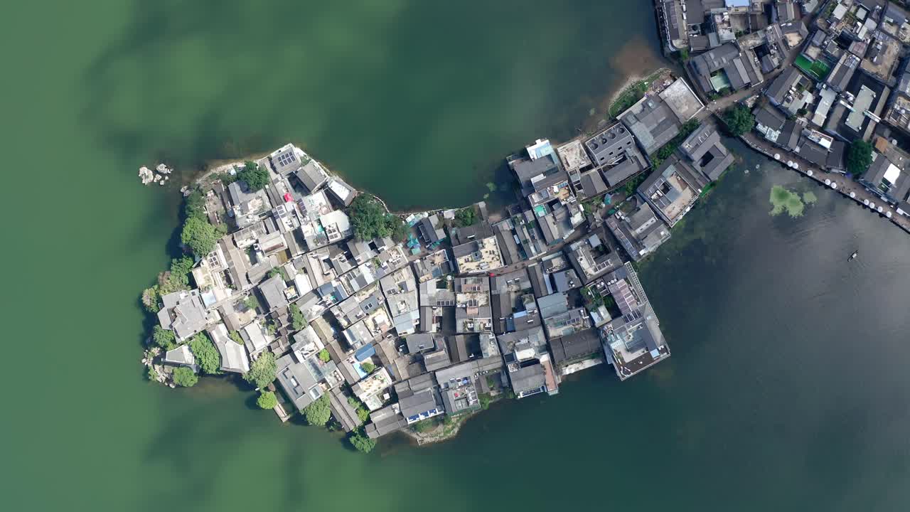 Village and lake in Shuanglang, Yunnan, China.