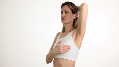 woman performing breast self-examination