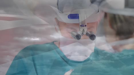 animation of uk flag over doctors during surgery