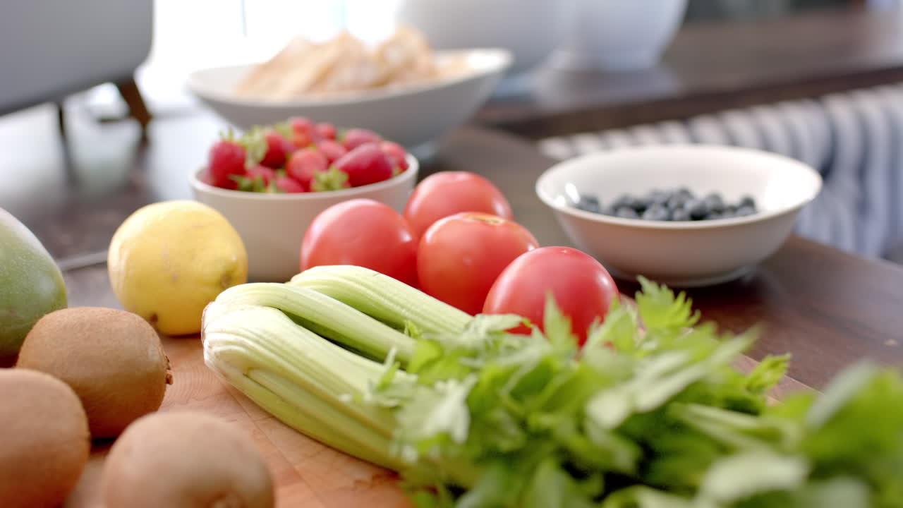 Fresh vegetables and fruits on kitchen counter, ready for healthy meal preparation