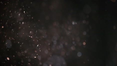 floating abstract particle bokeh on dark background