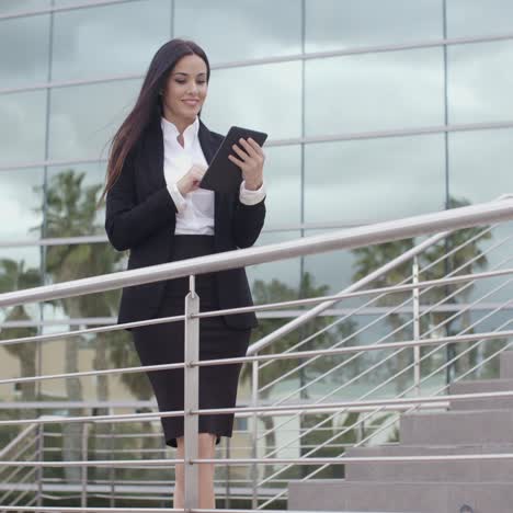 young businesswoman standing on a concourse