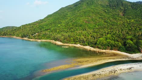 Thailand-coast-with-hils-and-palm-forest,-small-channel-and-emerald-sea-water