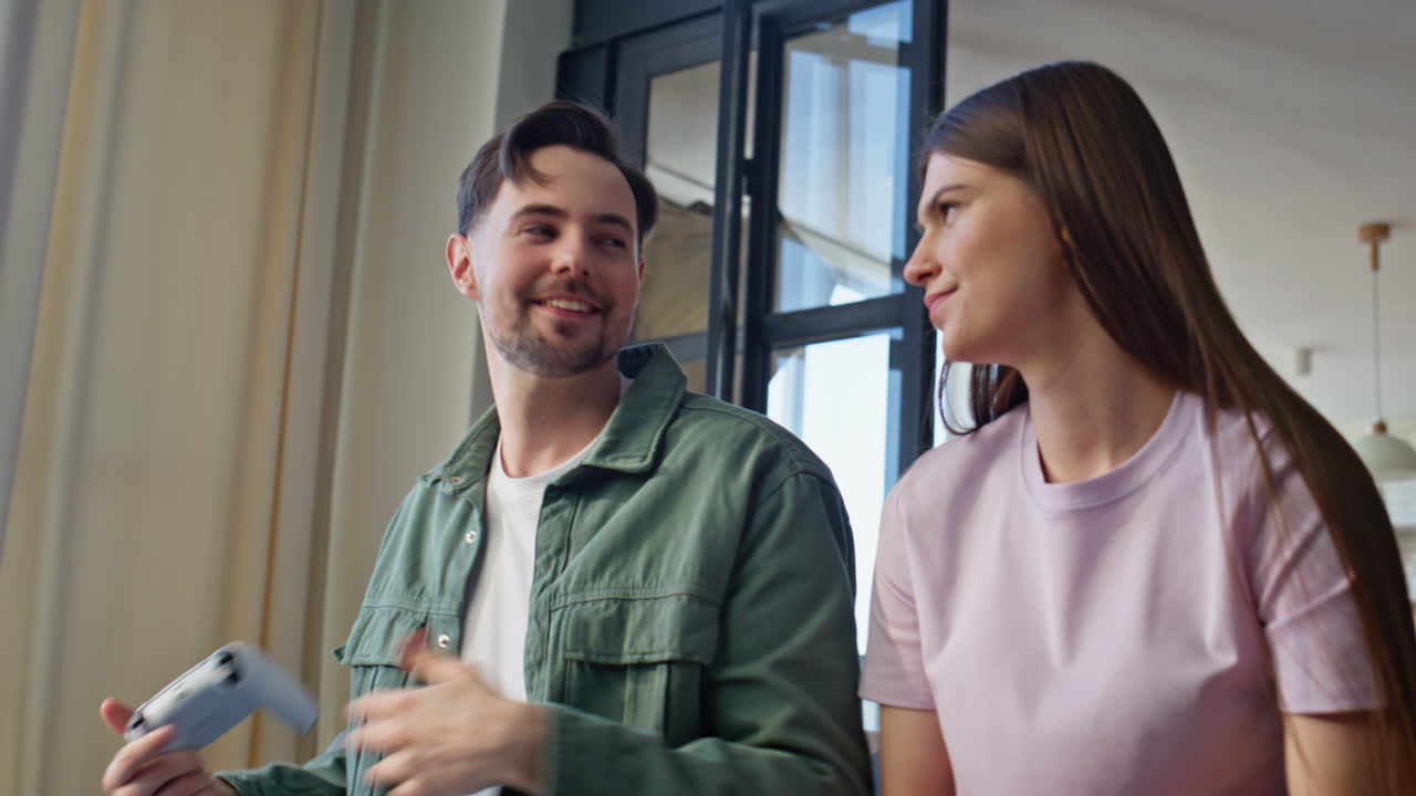 Man winning online game at weekend with woman at home closeup. Losing girlfriend