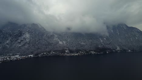 Footage-filmed-with-a-drone-over-a-lake-by-a-town-called-Hallstatt-in-Austria-in-Europe