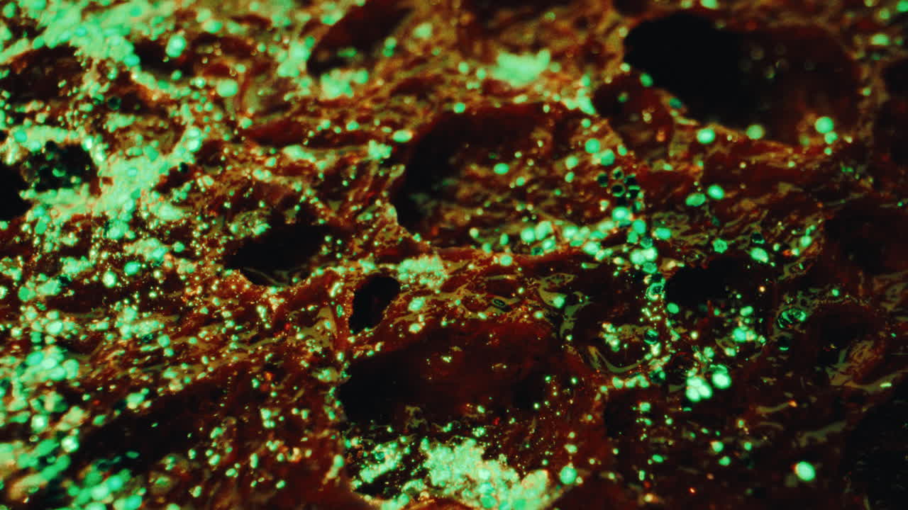 Close-up view of textured surface with green glitter