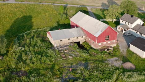 aerial drone view of a huge barn farmhouse in countryside