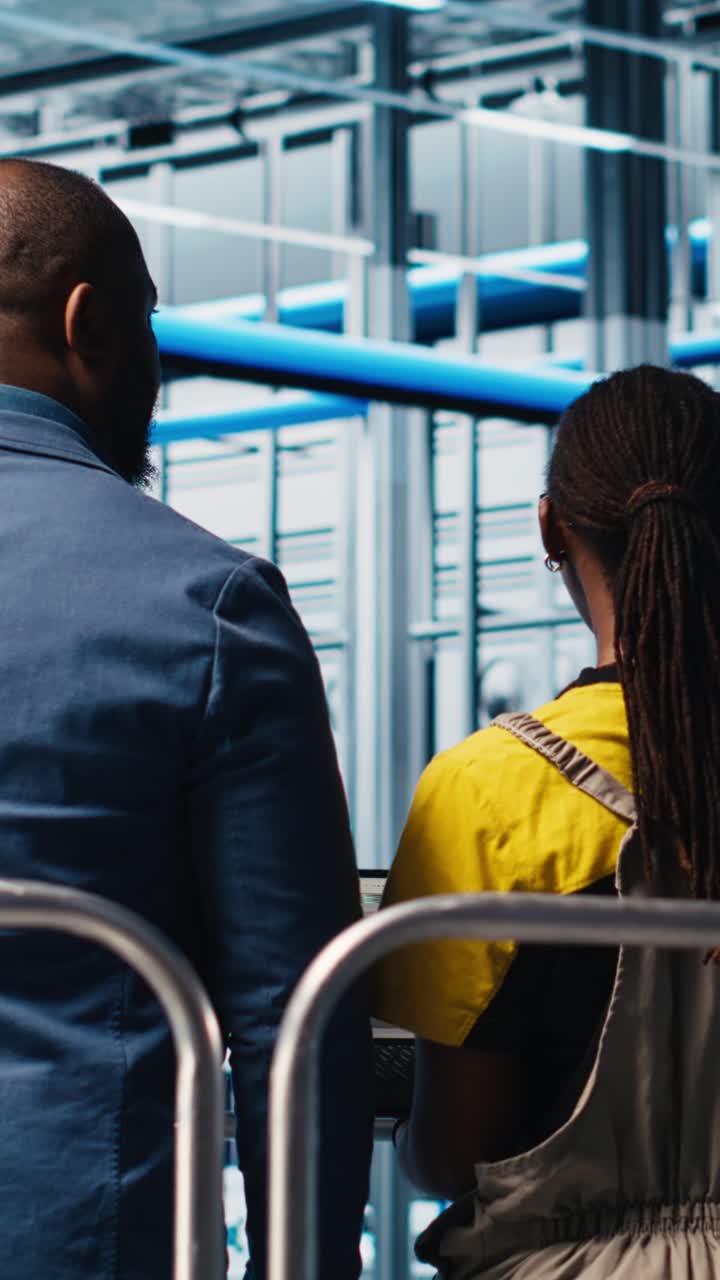 Vertical video Manager on industrial platform overseeing industry 4.0 photovoltaics plant