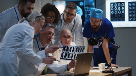 medical professionals reviewing x-ray images