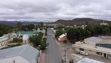 aerial shot over a road in a rural city south africa cloudy day