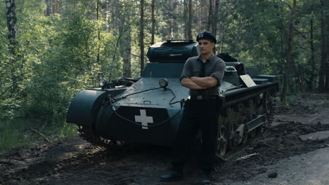wwii soldier by a military vehicle
