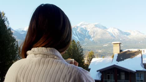 woman having coffee in balcony