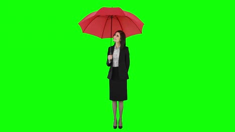 Businesswoman-standing-under-umbrella-