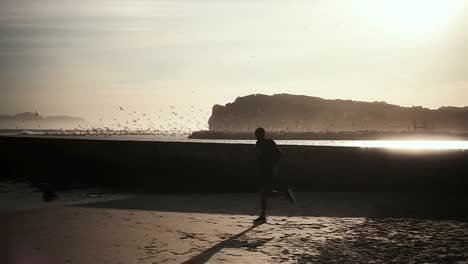 man running on the beach
