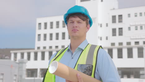 architect, construction worker with blueprint