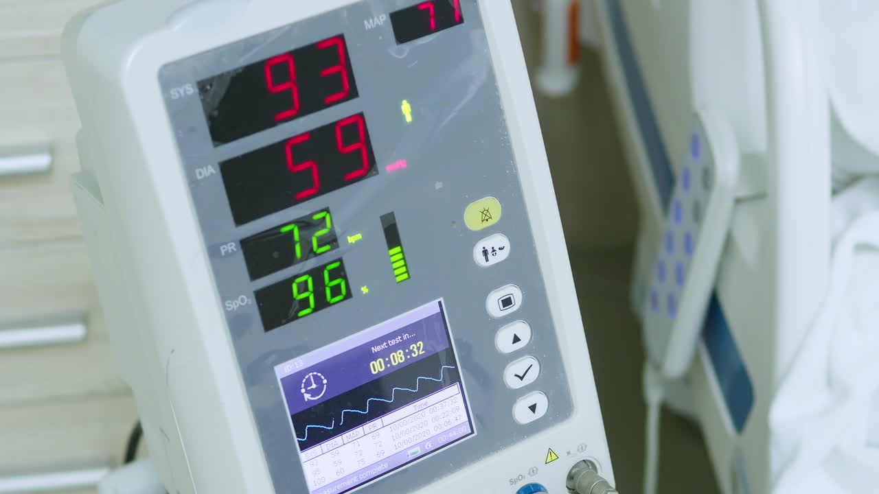 This image shows vital sign monitors displaying key health metrics in a hospital setting