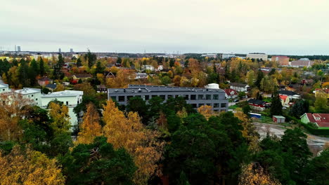 Flying-Above-Fall-Trees-Revealing-Swedish-Architecture-In-Sweden