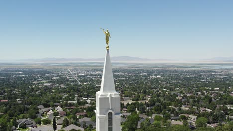 moroni statue on lds mormon temple steeple in bountiful, utah - aerial orbit