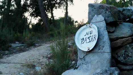 no trespassing sign in the mountain of ourense, galicia, spain on plate with copper wire