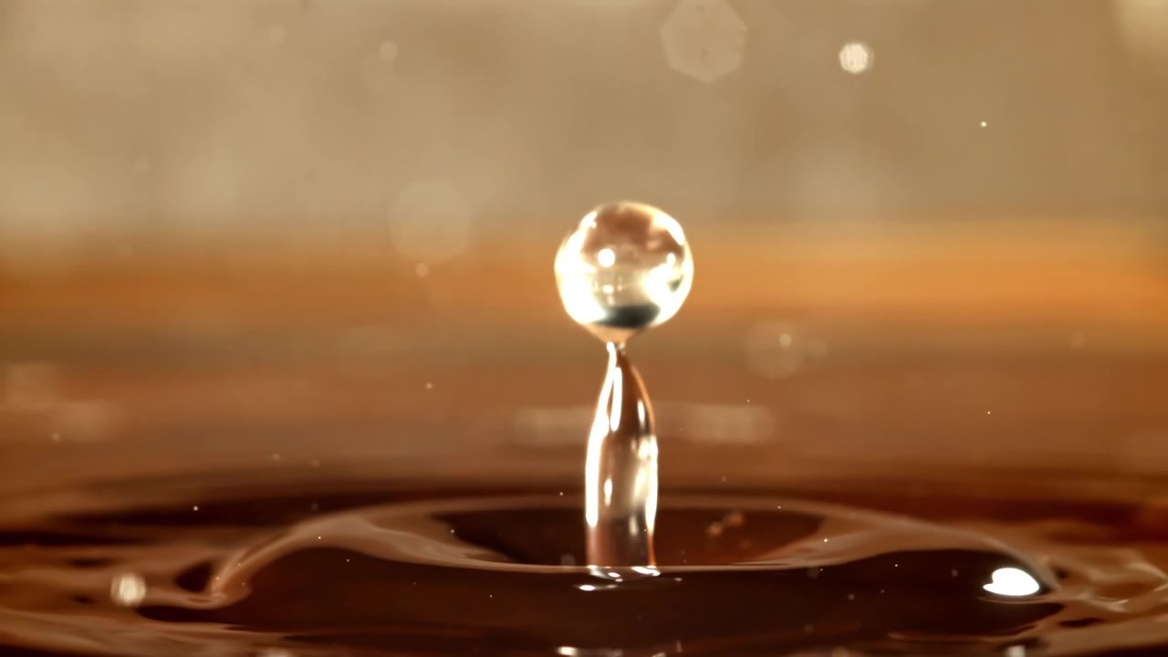 Close-up of a Water Drop Creating a Crown Splash in Slow Motion