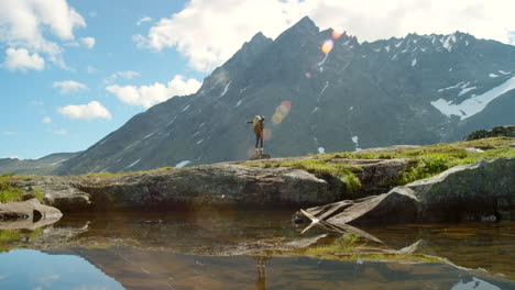 woman enjoying the view from a mountain peak