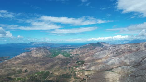 southern albanian coastline near the greek border, opposite corfu island, with treeless hills and mountain ranges