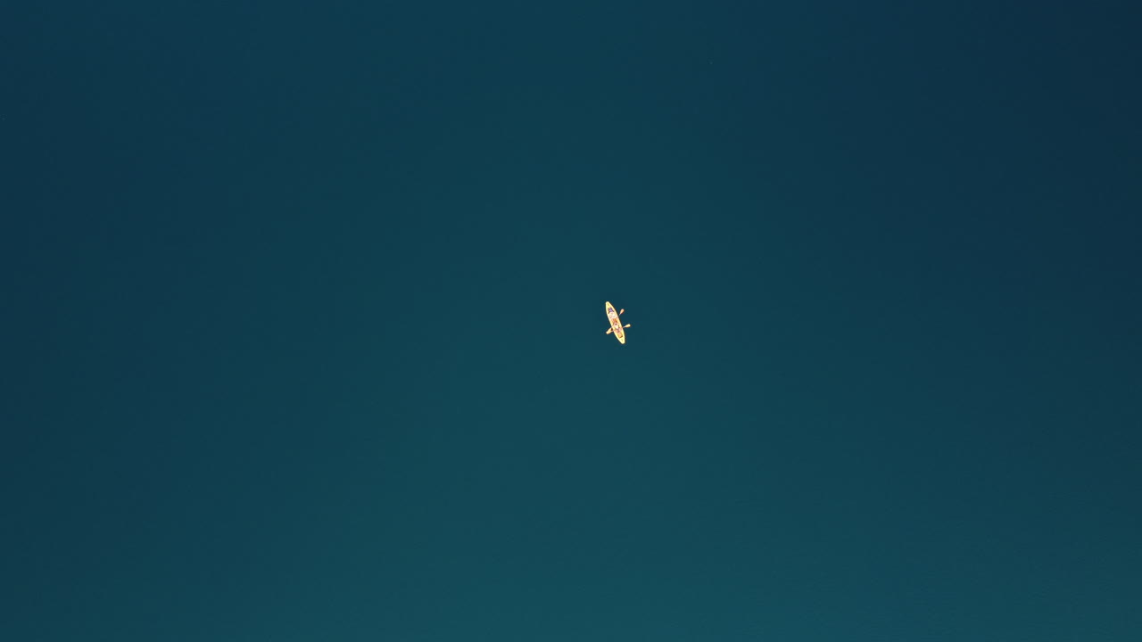 Kayaker on a Calm Lake