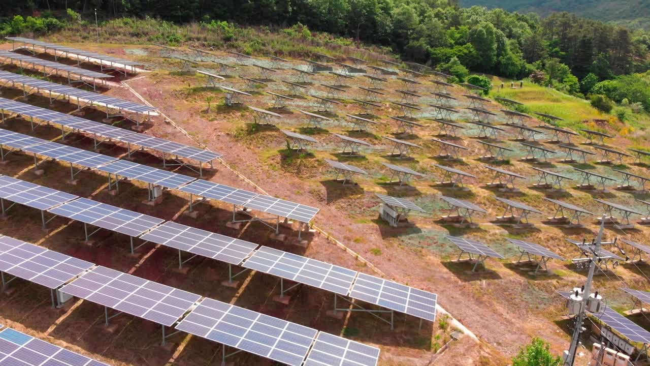 Aerial gentle rise up tilt down above Solar panels