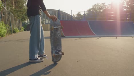 Camera-Focuses-On-Young-Man-Legs,-Skate-Shoes-And-Skateboard-On-Movement