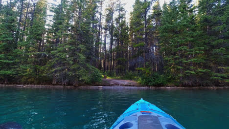 POV-of-kayaker-approaching-lake-shore-in-Alberta,-Canada