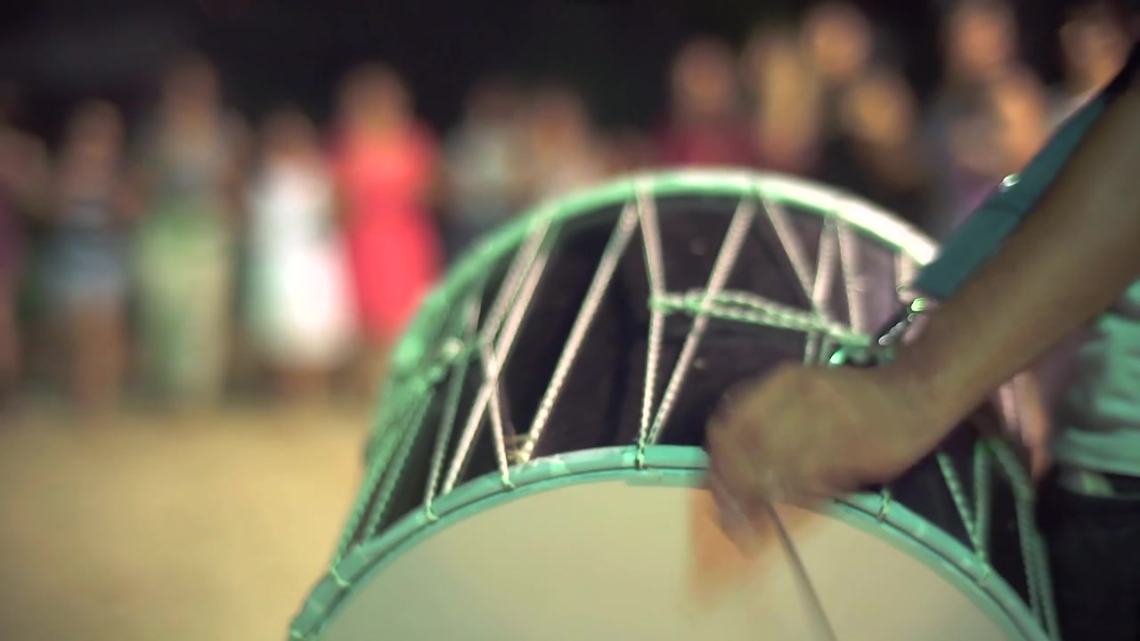 Musician Playing Traditional Turkish Davul Drum at Night