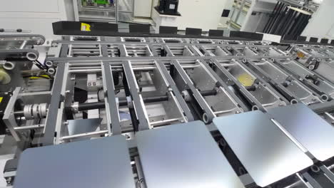 Photovoltaics-production-process-solar-panel-assembly-line-operated-by-high-tech-robot-arms-in-modern-sustainable-factory