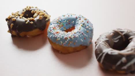 video of donuts with icing on white background