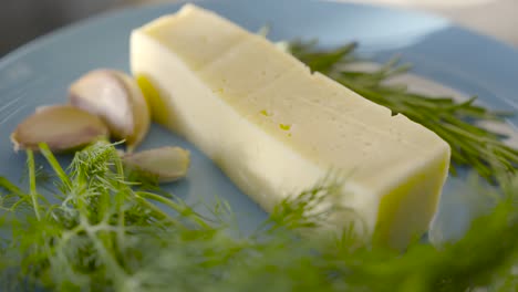 plate of cheese with herbs and garlic