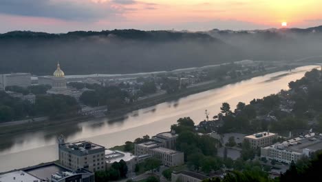 aerial pullout from the kanawha river and the west virginia state capital at sunrise